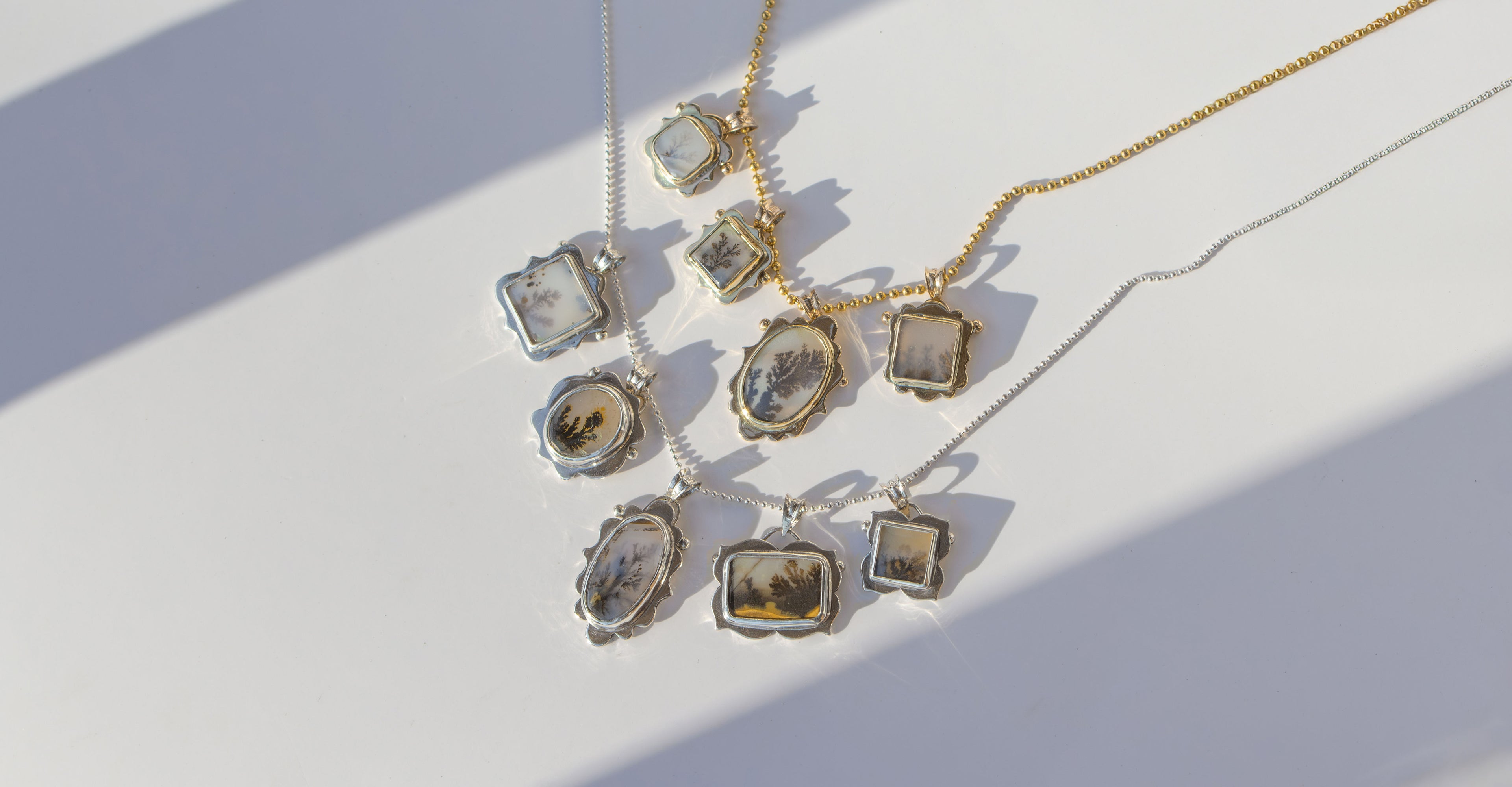 Necklaces with pendant on a white surface