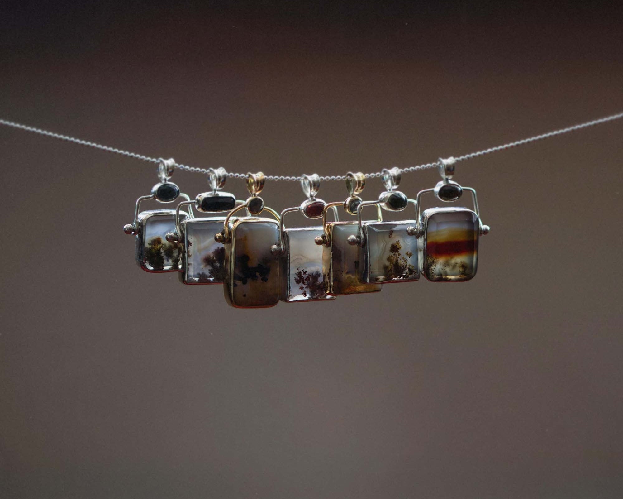 Necklace with rectangular pendants on a dark background